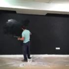 Smarter Surfaces’ Black Projector Screen Paint being applied