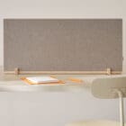 A Dezibel Flexible Table Screen in an office at a desk
