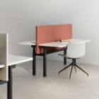 two Optima Duo with chairs in an office style setting 