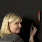 Smarter Surfaces Super Magnetic Chalkboard Paint package in a classroom setting