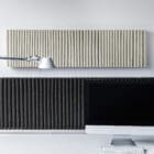 Multiple HEY-SIGN wall module wave landscape products shot on a wall in an office above a desk