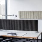 The HEY-SIGN wall module wave landscape product shot on a wall in an office above a desk