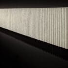 The HEY-SIGN wall module wave landscape product shot on a wall in an office