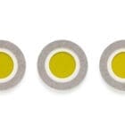 The Dot wall element from HEY-SIGN grouped in bright yellow and grey