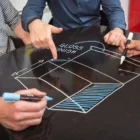 Clear Whiteboard Paint from Smarter Surfaces being used on a desk
