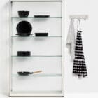 Pictor display cabinet by Functionals in use with coat rack