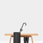 Revolved Umbrella bin by Functionals is equipped with a convenient drip-tray seen with umbrella